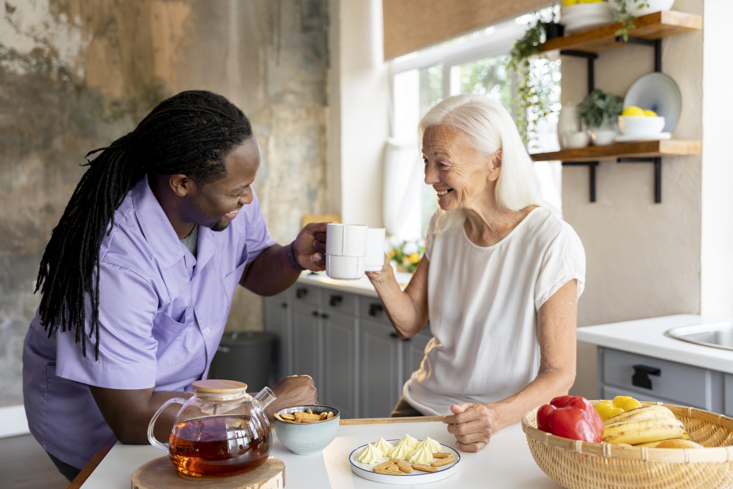 Care worker warmly helping a senior woman